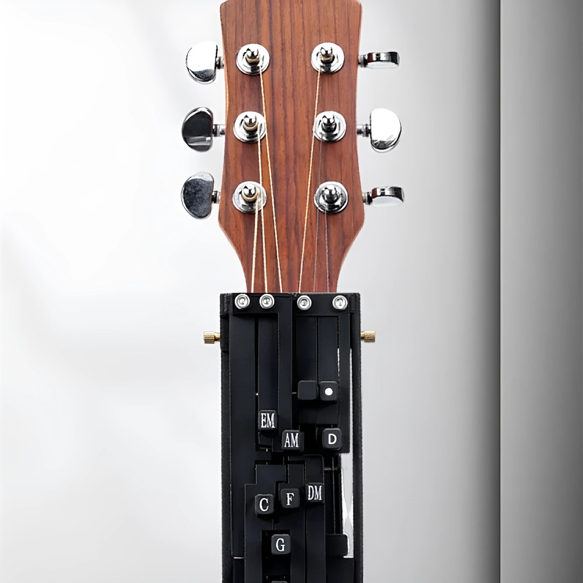 Black auxiliary folk guitar chord practice device with automatic gear mechanism for beginners