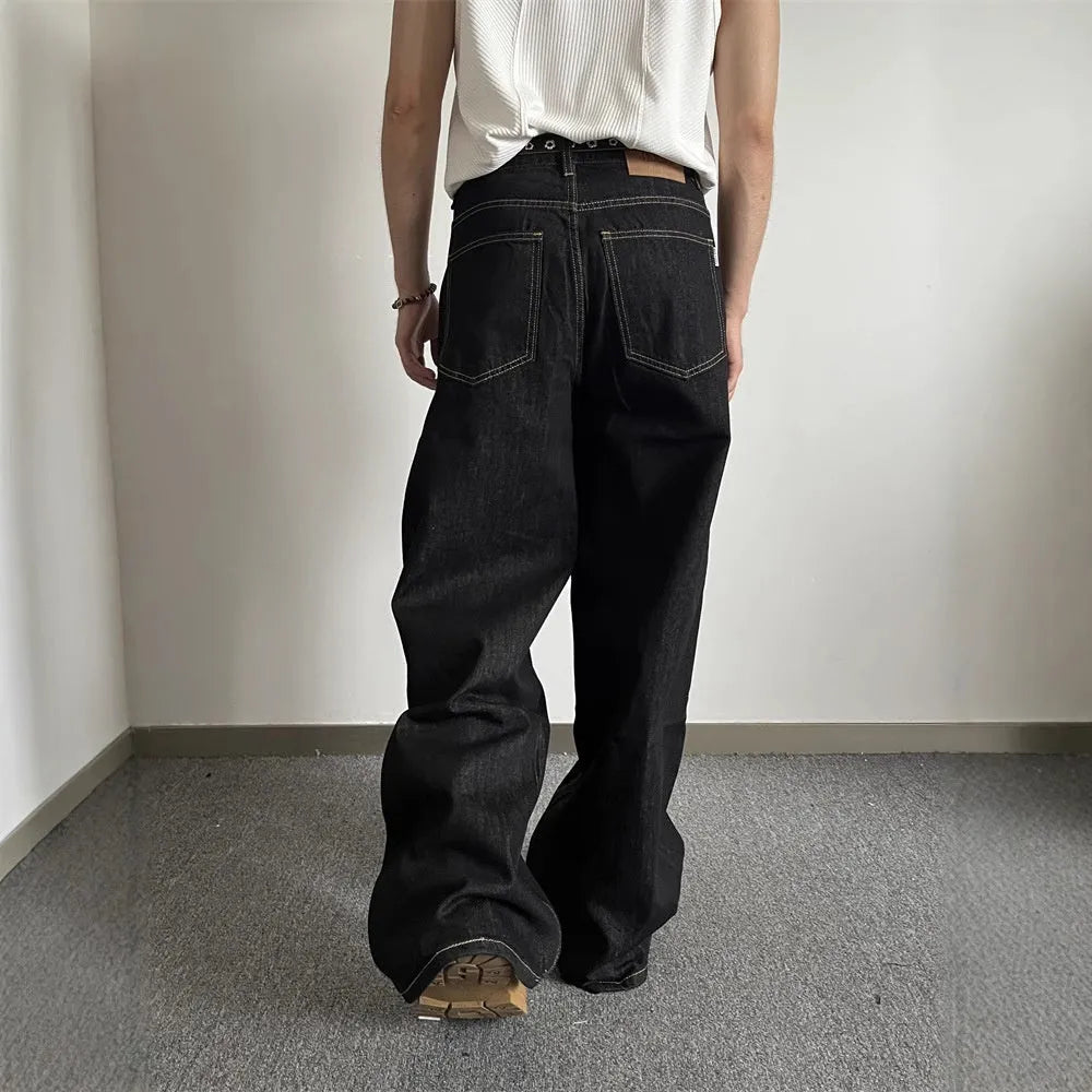 Black retro loose wide-leg jeans with a straight leg cut and zip fly on a mannequin.