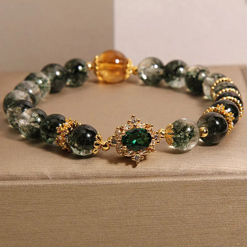 Women's crystal bracelet with gold rutilated quartz, green phantom quartz, and ruby quartz gemstones