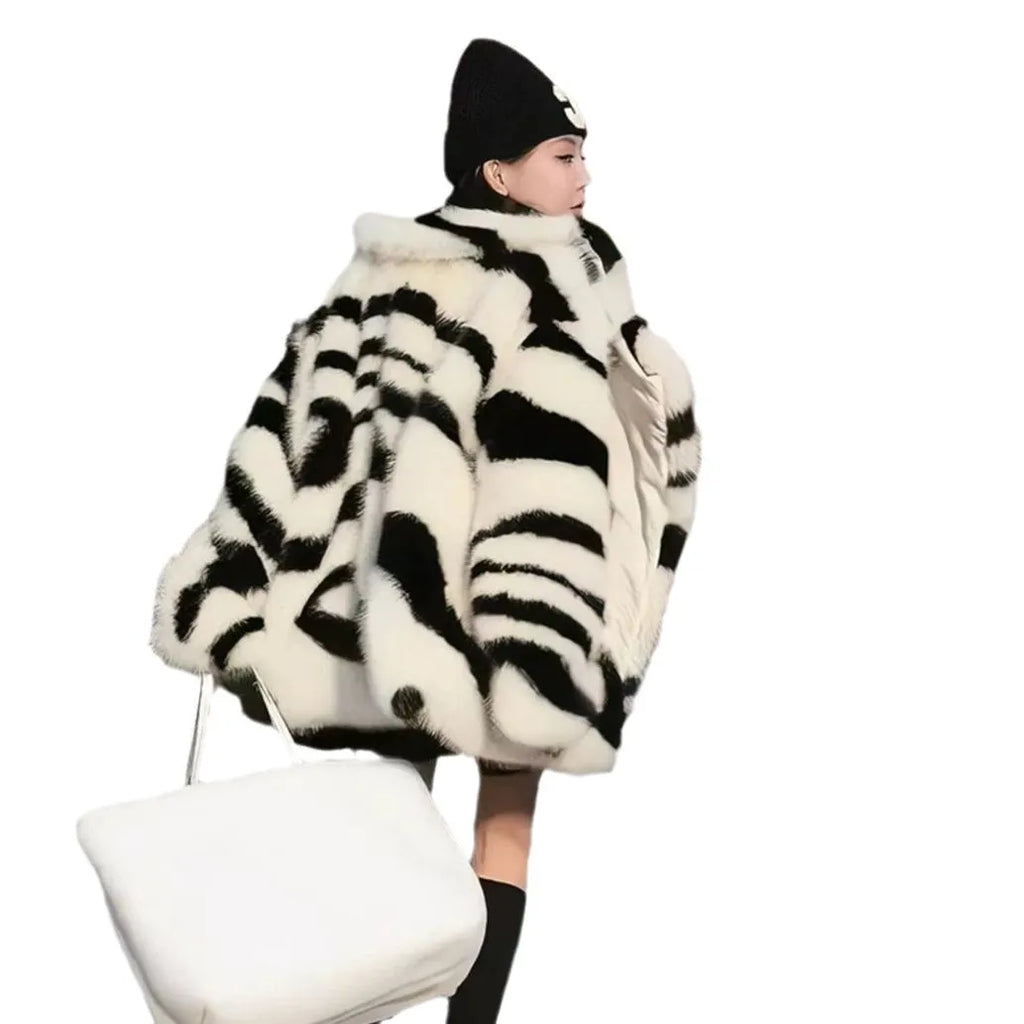 Women's zebra stripe pattern fur top with large skimmer collar and long sleeves in street fashion style