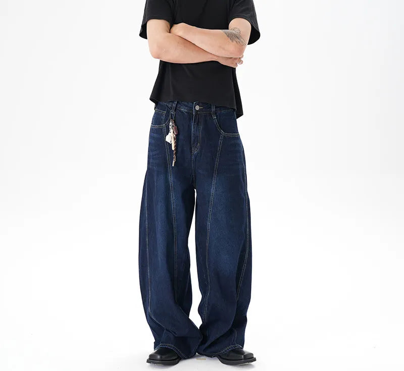 Dark blue wide leg women's jeans with a machete cut and distressed detailing on denim fabric.