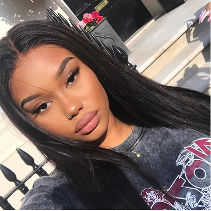 Long straight black synthetic wig with centre-parted bangs on a hair cover