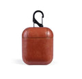 Genuine leather protective case for Apple AirPods charging case in black, brown, light brown, and red.