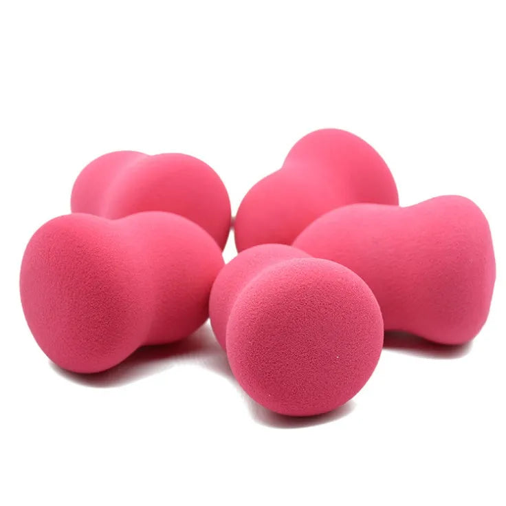 Pink square makeup blending sponge on a white background.