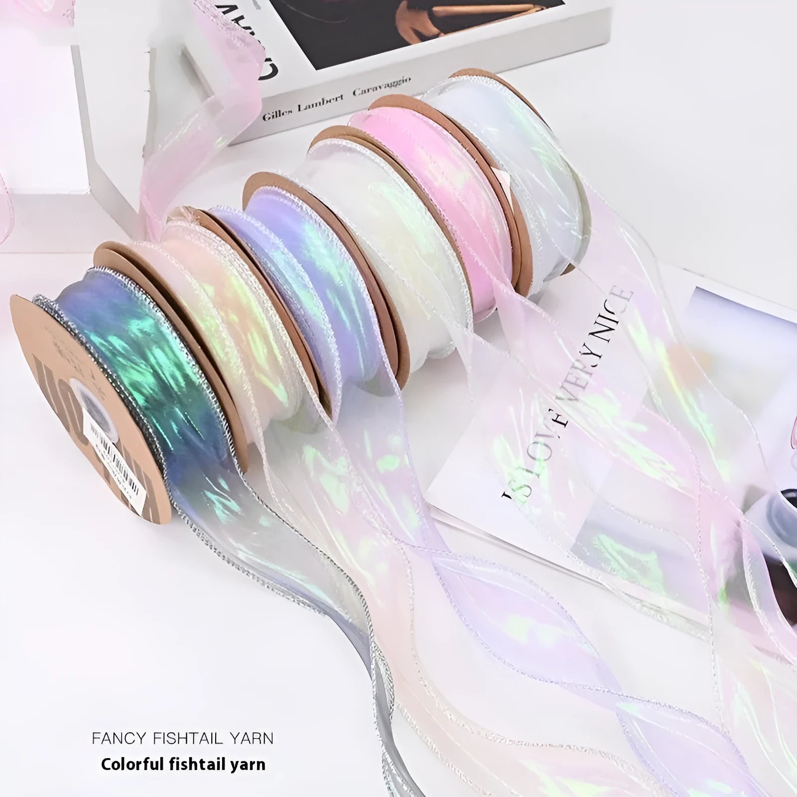 Roll of colourful fishtail yarn mesh ribbon with wave texture, shown in 4cm width.