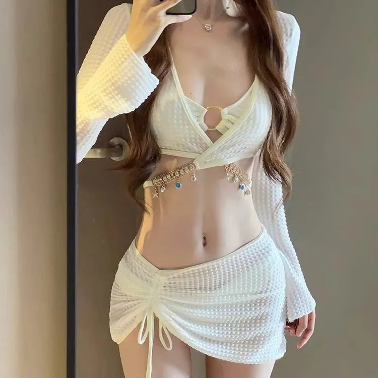 Women's long sleeve bikini swimsuit in black or white colours for swimming activities