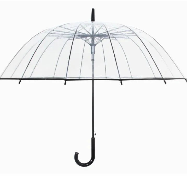 Long-handled transparent umbrella with black steel frame and white handle on a black background.