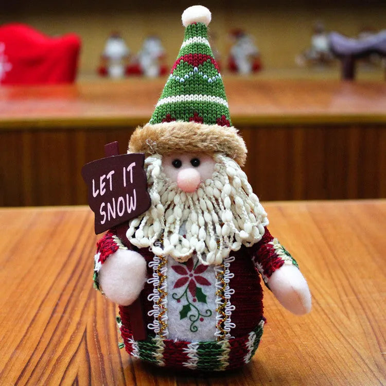 Set of red, green, and white flannel Christmas decorations including a snowman, elk, and old man figure.