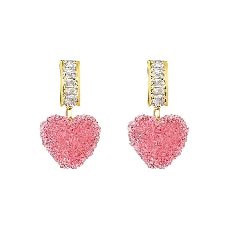 Blue and pink candy-style heart-shaped alloy stud earrings for women on a white background.