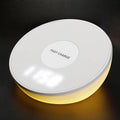 White smart wireless charger with digital clock display and three control buttons.