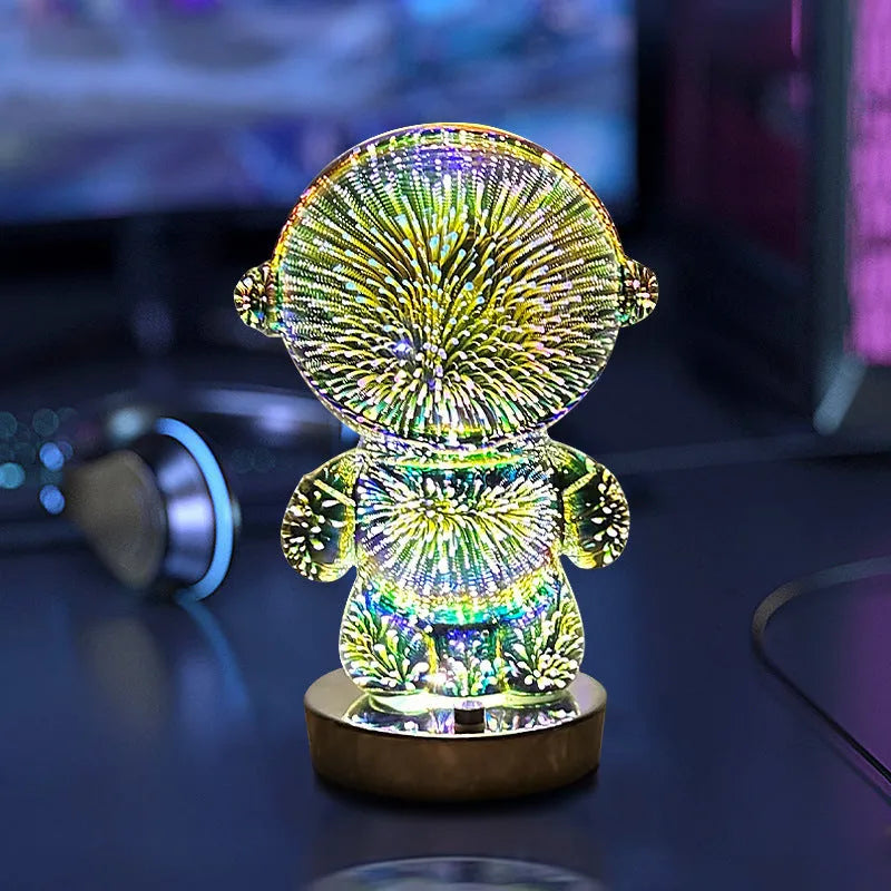3D stereo astronaut atmosphere light with glass shade and USB charging on a desk