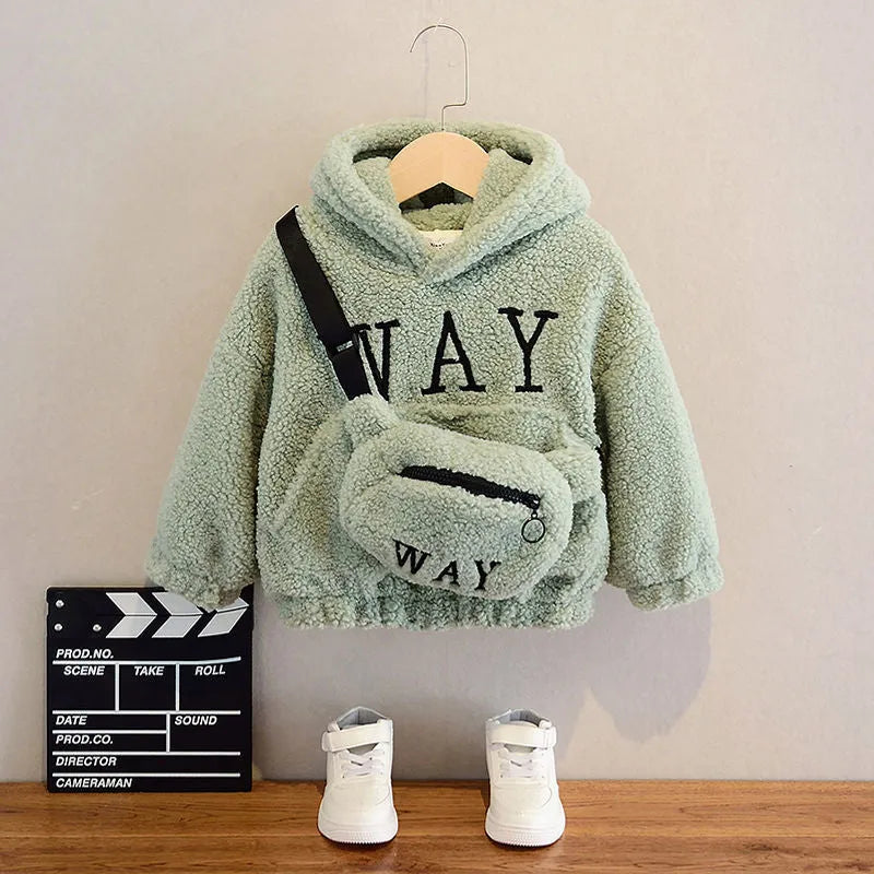 A child's beige fleece jacket with a cartoon pattern, featuring a hood and long sleeves.