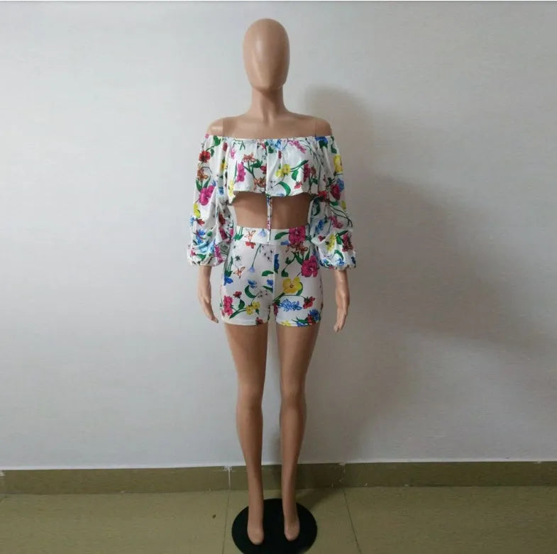 Multicolour digital print women's two-piece outfit with pile sleeve top and matching shorts.