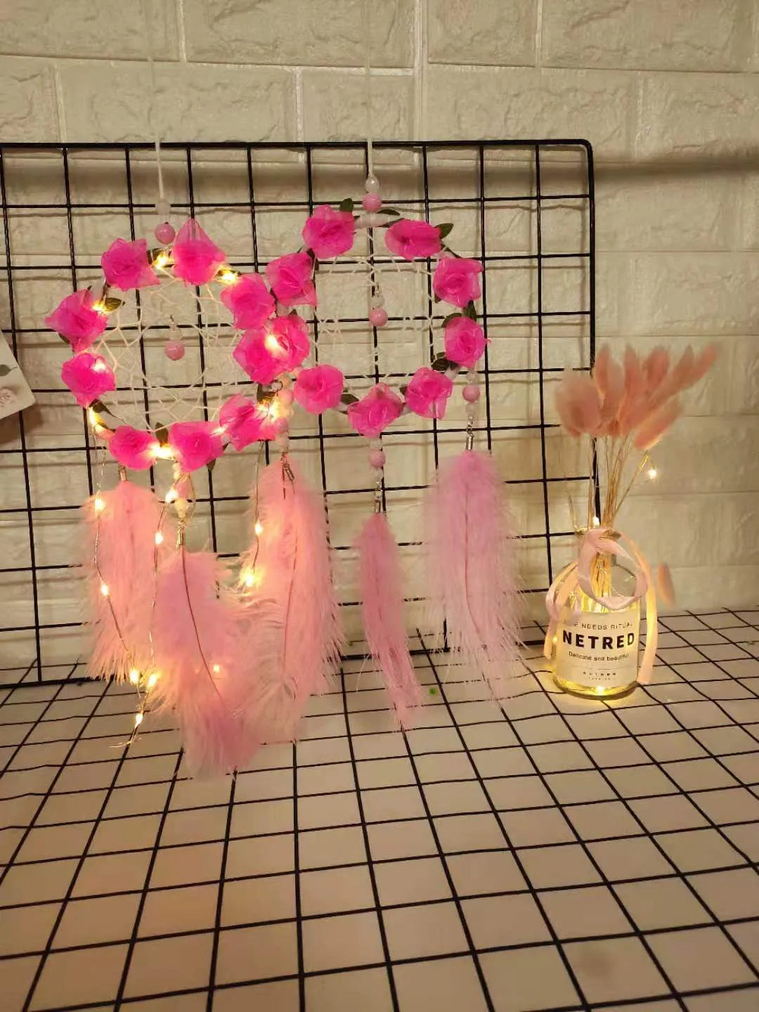 Pink dreamcatcher wind chime with ostrich feather ornaments, 10cm diameter wall decoration