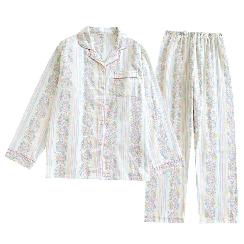 Women's red fruit print cotton gauze long-sleeved top and trousers two-piece loungewear set laid flat.