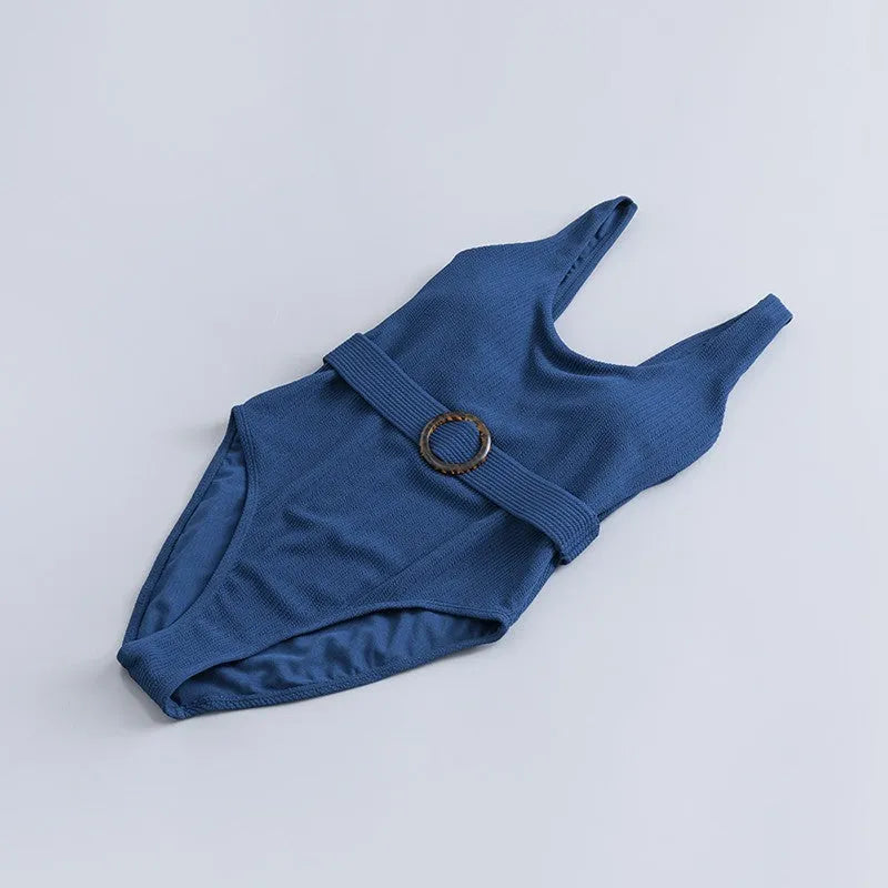 Navy blue women's one-piece sleeveless swimsuit with triangle neckline and slim-fit design.
