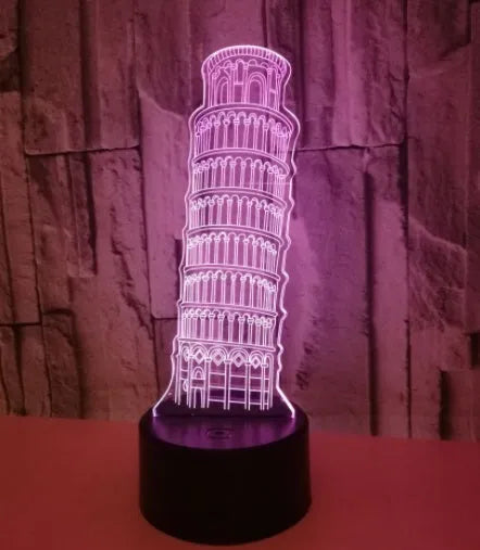 3D acrylic Leaning Tower of Pisa night light glowing in blue on a black base with remote control.