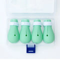Four green silicone cat paw covers for anti-scratch protection during washing and medication
