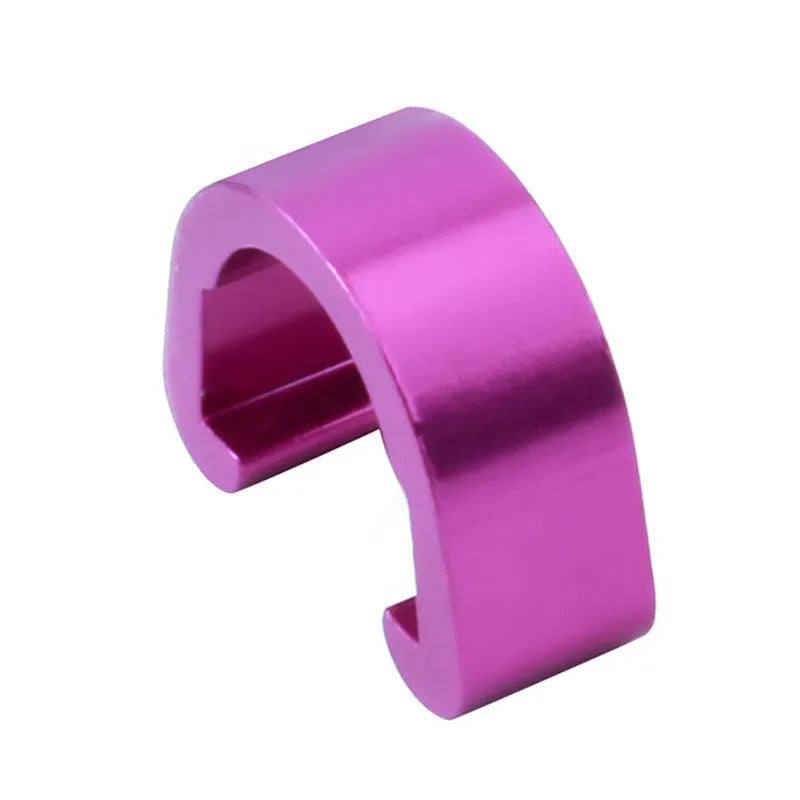 Set of ten small aluminium alloy C-shaped buckles in various colours on a white background.