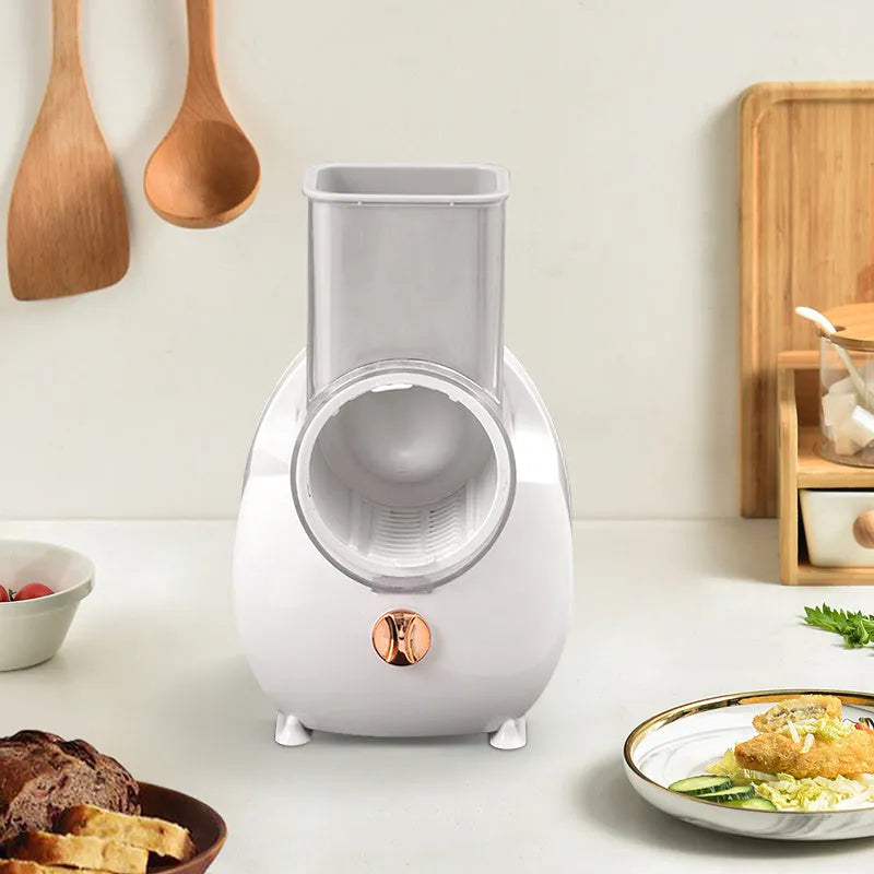 White electric vegetable slicer with rotary grater and suction base for kitchen use