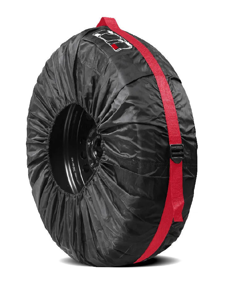 Set of four black Oxford cloth tyre protective covers with red belt closures laid flat.