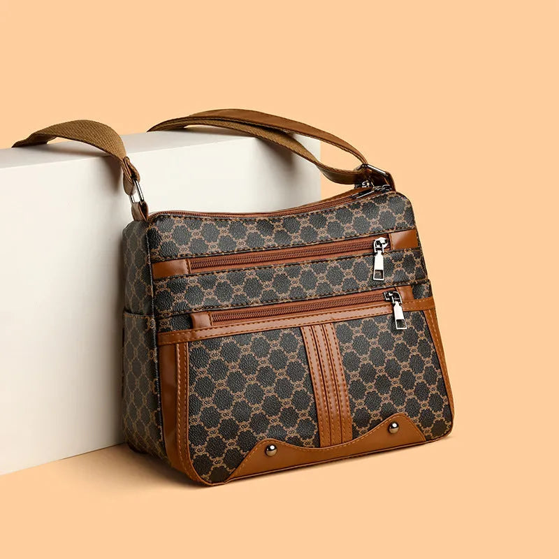 Brown women's crossbody bag with stitching pattern detail and large capacity interior
