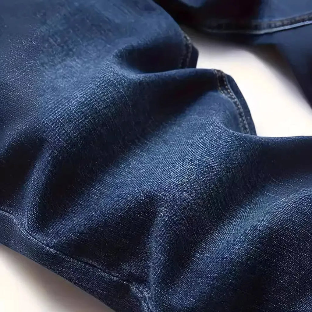 Men's slim-fit dark blue casual jeans with a worn wash and medium elastic cotton fabric.