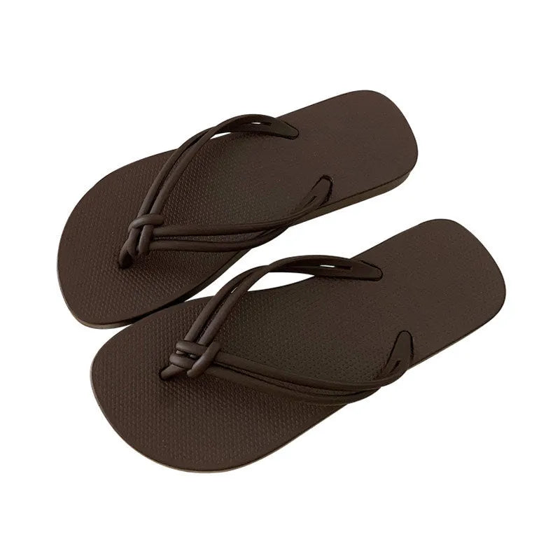 Men's casual PVC flip flops in beige with toe-covering design and textured non-slip sole.