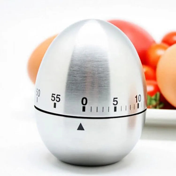 Stainless steel mechanical kitchen timer with egg-shaped design showing 60-minute dial