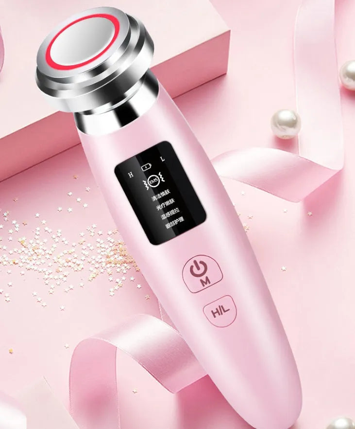 Pink cleansing and rejuvenating beauty instrument showing 185mm length and compact design
