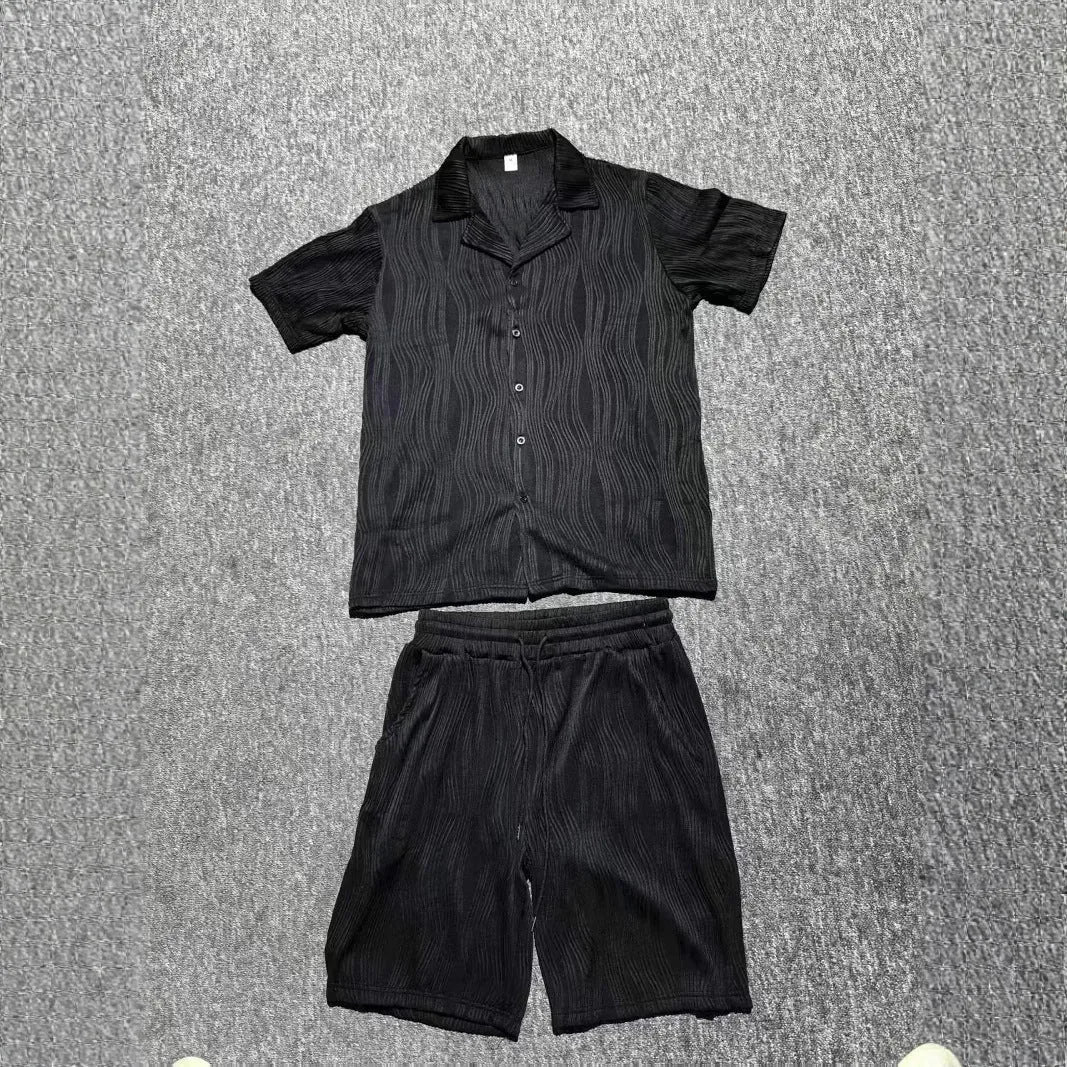 Men's black wave pattern shorts suit set with short sleeve shirt and matching shorts on hanger