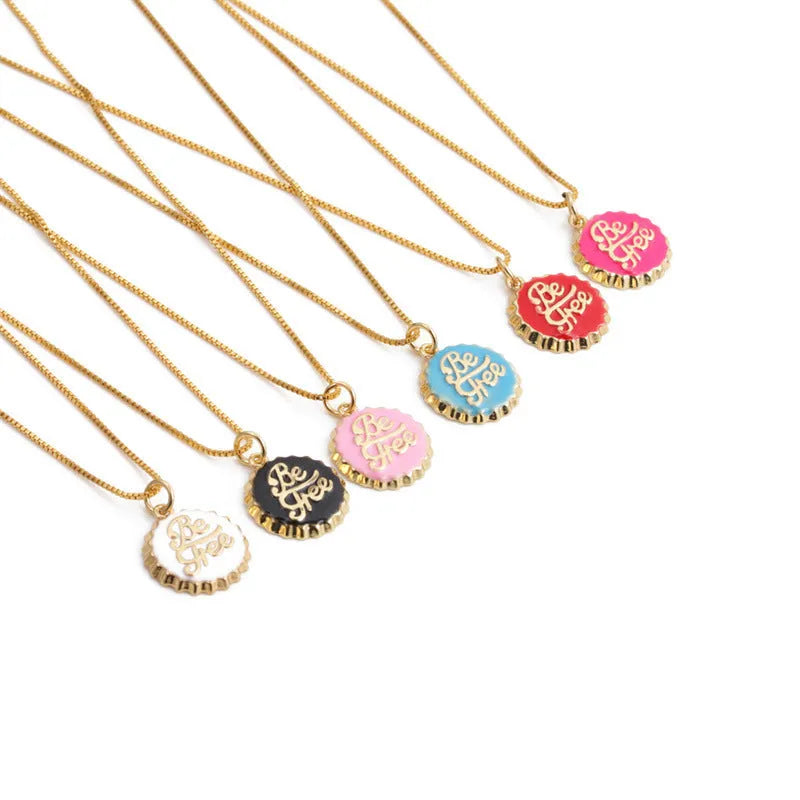 Copper bottle cap pendant necklace with electroplated gold finish on a 40cm box chain.