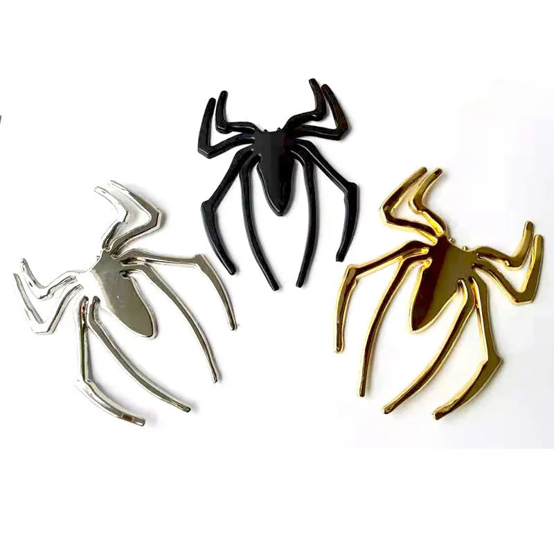 Three-dimensional zinc alloy spider emblem sticker in gold, measuring 7cm by 5cm.