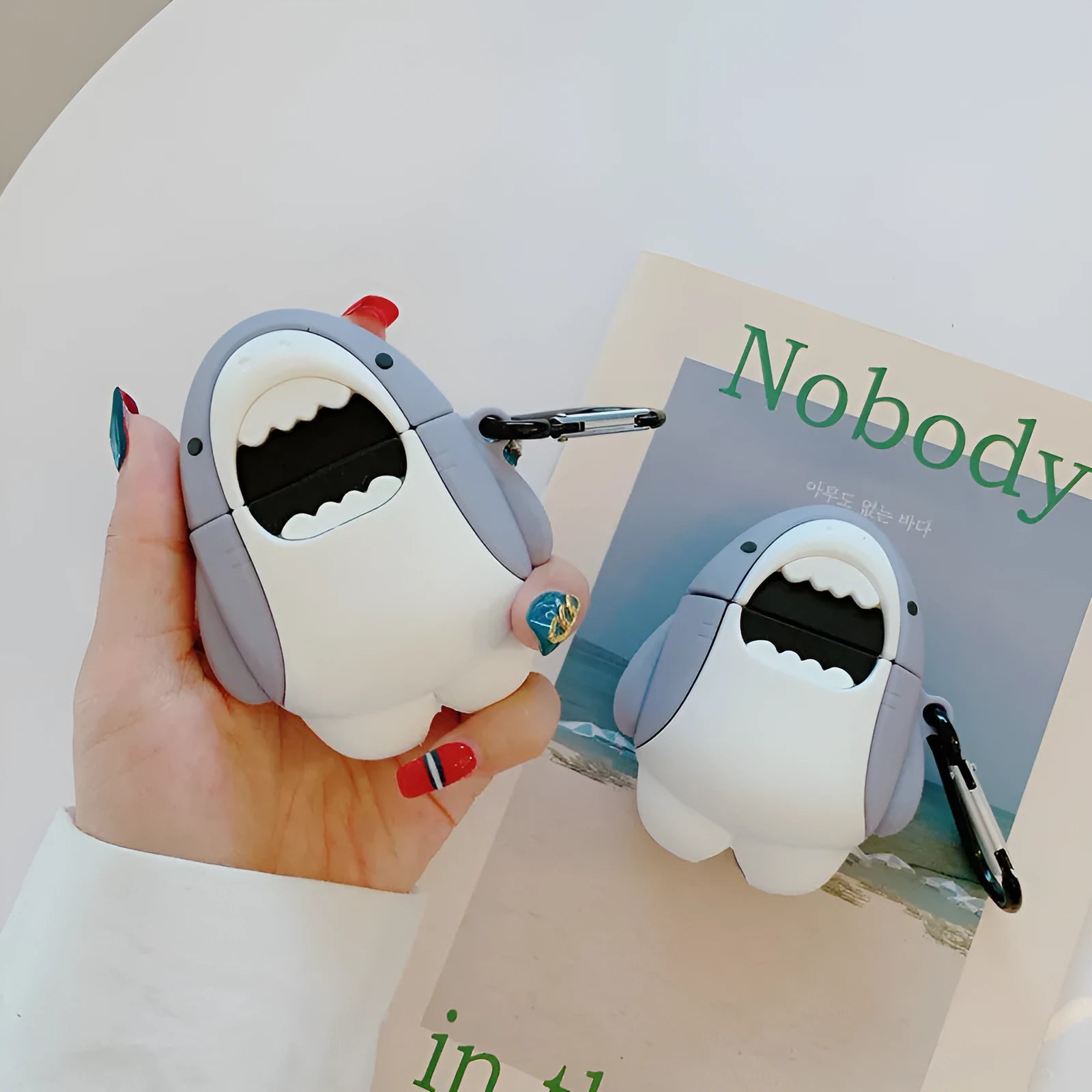 Silicone shark fin covers for AirPods 1 and 2 with personalised female accessory patterns