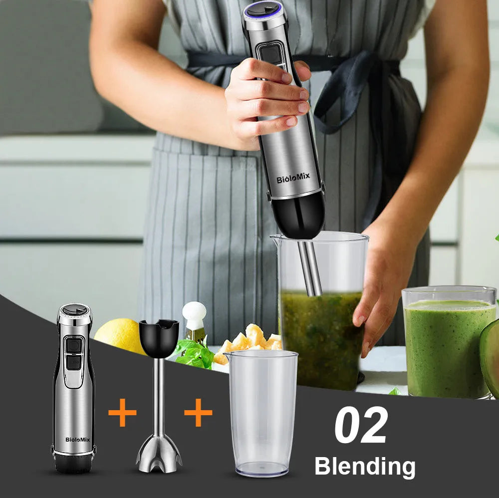 Silver and black Biolomix hand blender set with motor, stainless steel shaft, whisk, chopper bowl, and blending beaker on a kitchen counter.