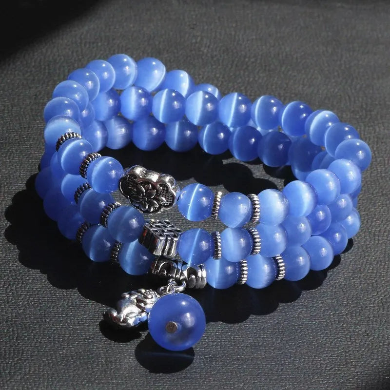 Three-ring opal bracelet with cat eye design and lucky cat elements in geometric shape
