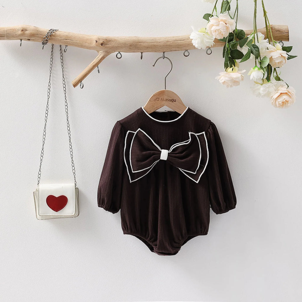 Cotton baby bow long sleeve onesie in black or white, triangle jumpsuit style, sizes 66-100cm