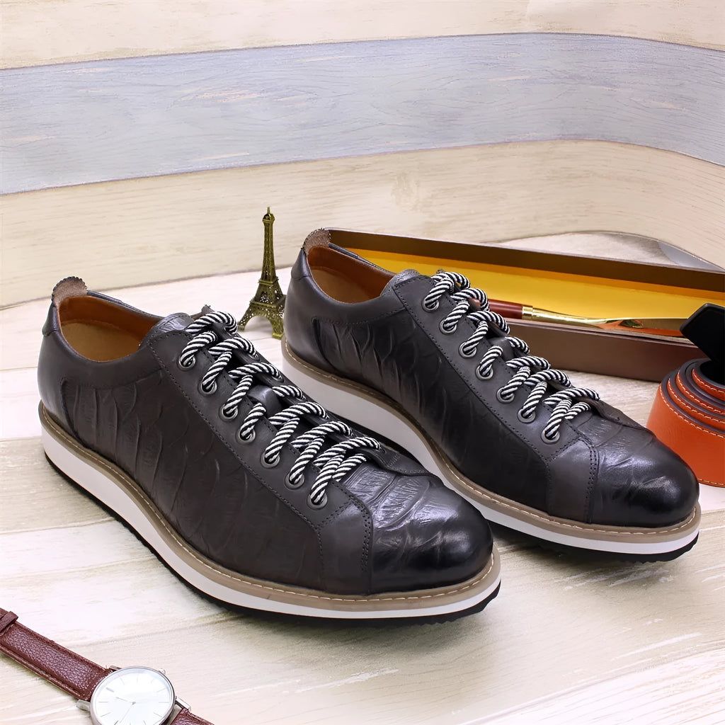 Men's low tube casual shoes with an embossed pattern on the upper and front tie laces.
