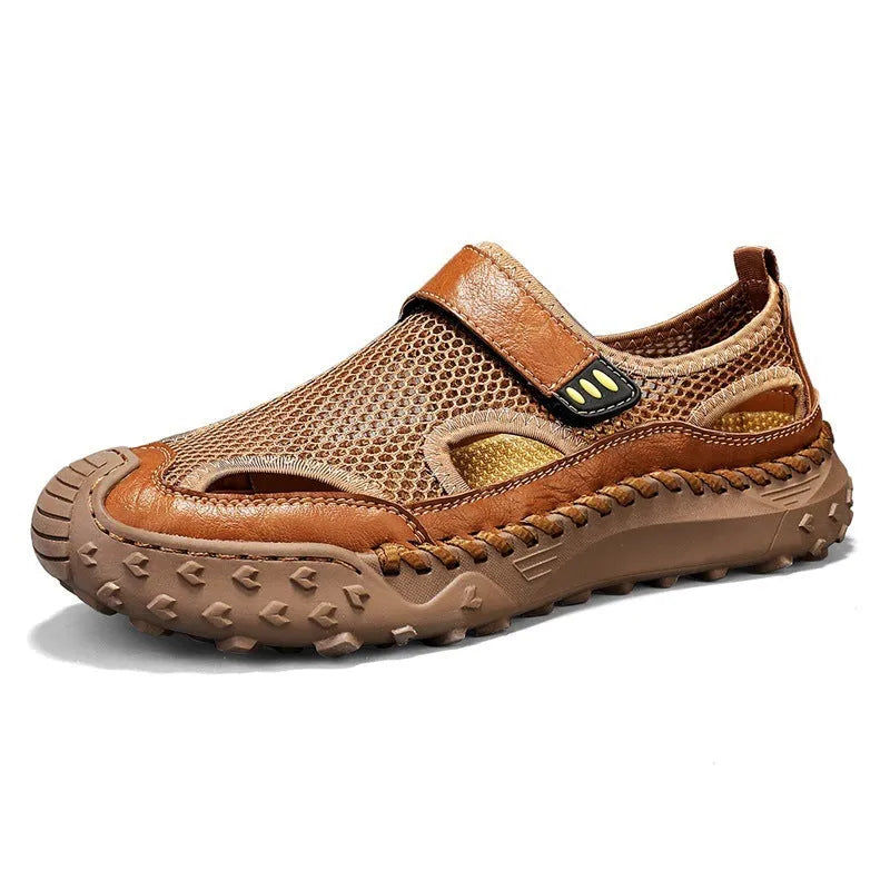 Men's black casual sandals with mesh upper and Velcro straps on a rubber sole.