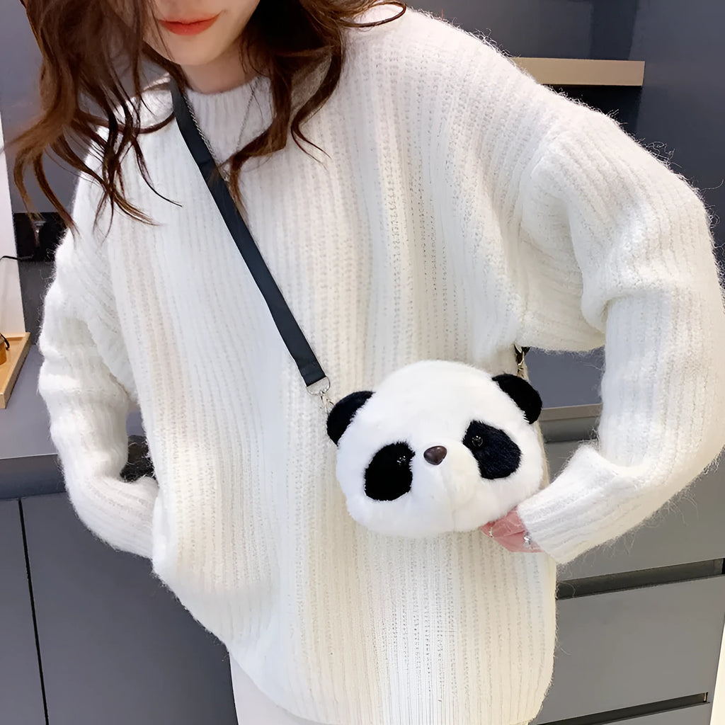 Soft plush cylindrical panda head crossbody bag with a shoulder strap.