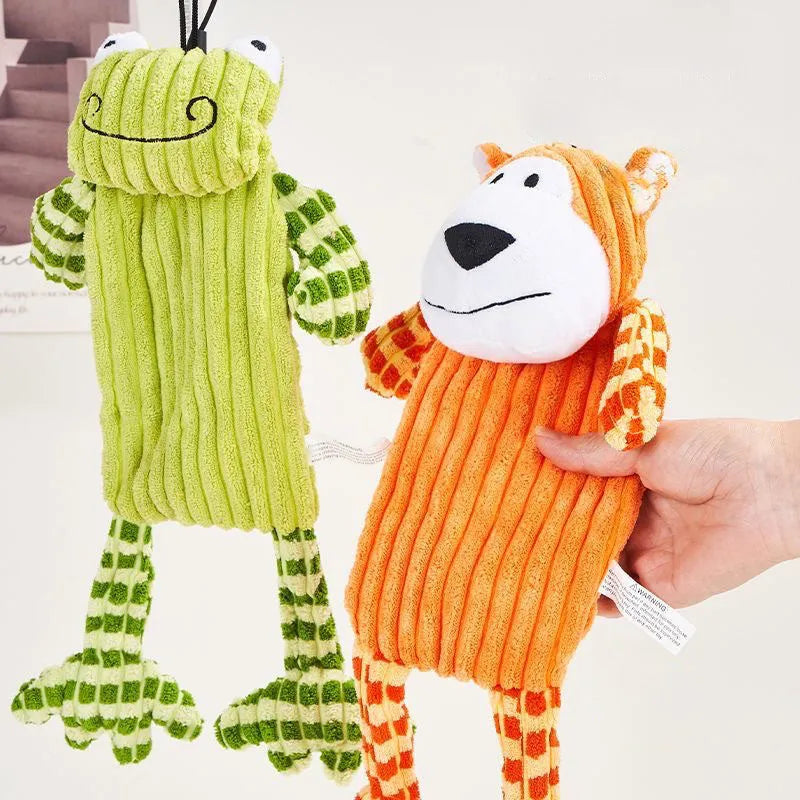 Orange and green plush dog toy with squeaker for aggressive chewers