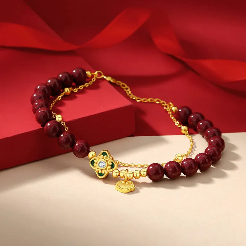 Sterling silver women's bracelet with Ruyi and Xiangyun motifs and cinnabar flower details