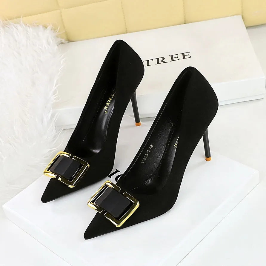 Black suede women's high-heel shoes with a 9cm stiletto heel and pointed toe on a plain background.
