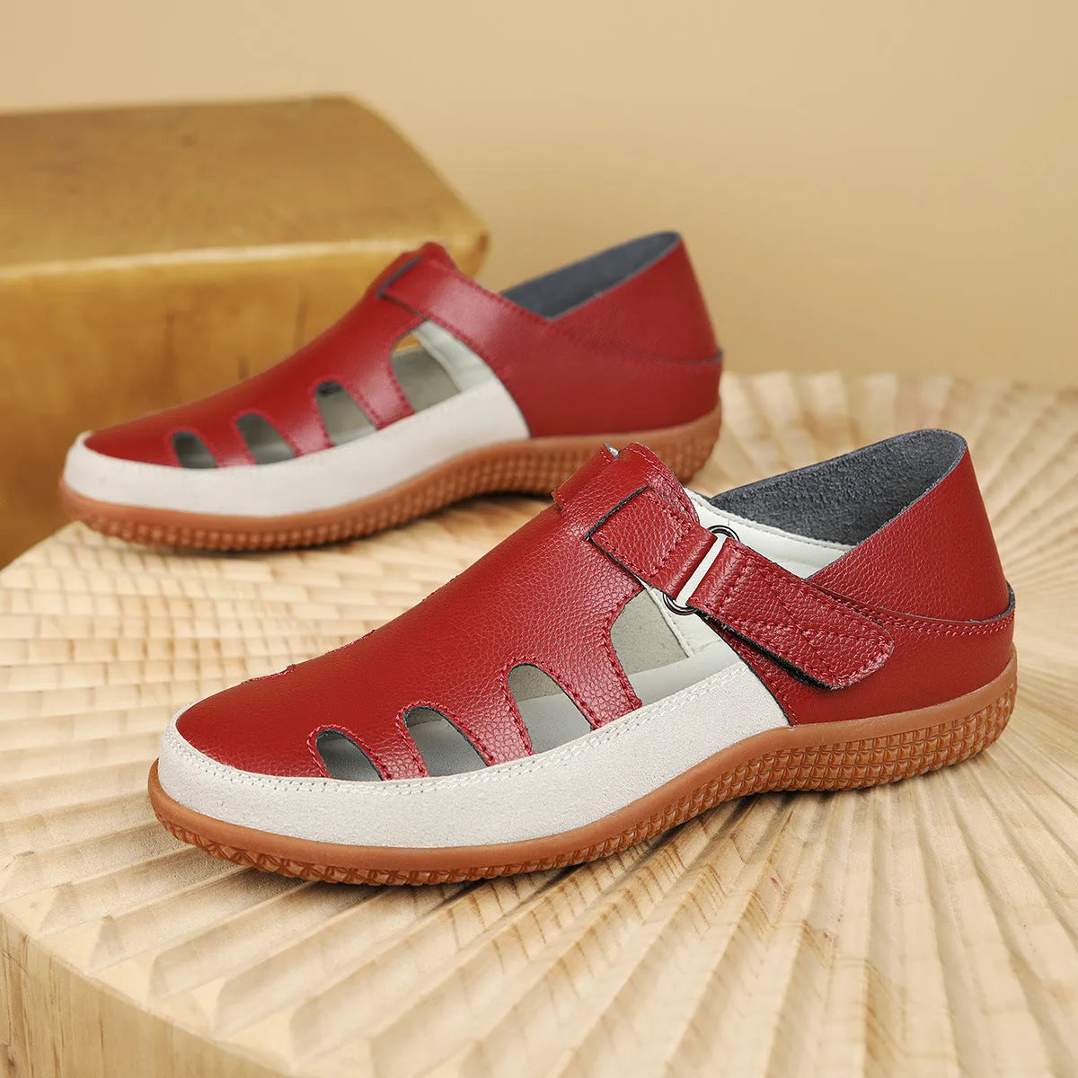 Plus size white women's sandals with hollow toe design and thick flat rubber sole.