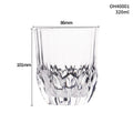 Clear thick-bottom whiskey shot glass on a table, one of 12 available colour variations.