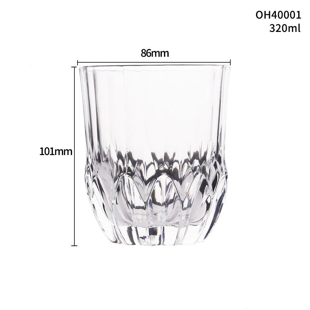 Clear thick-bottom whiskey shot glass on a table, one of 12 available colour variations.