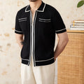 Slim-fit black knitting polo shirt with a lapel collar and short sleeves on a neutral background.