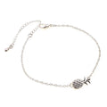 Women's alloy bracelet with a simple pineapple charm in a choice of gold or silver metallic finish.