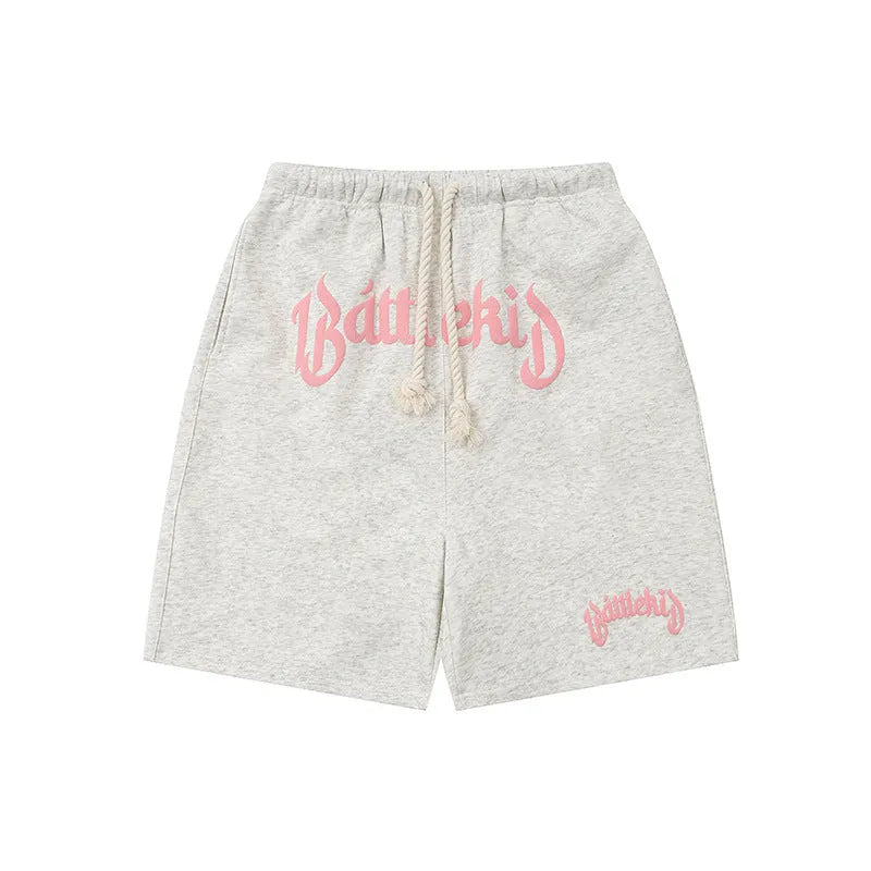 Men's loose-fitting cropped sweatpants in black, made from cotton-blend fabric.