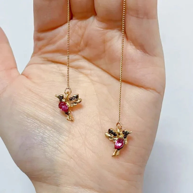 Long hanging bird earrings for women with alloy construction and mixed zirconium wings in red, blue, or red lvzuan.
